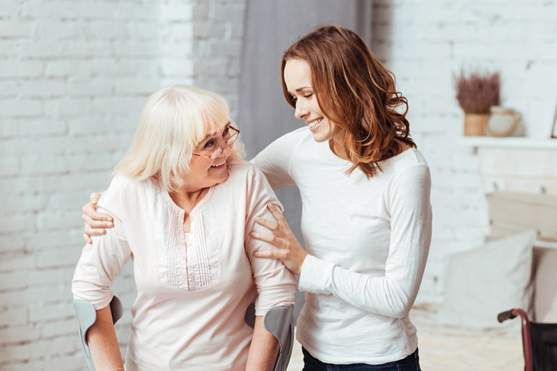 A nurse caring for an elderly woman