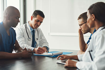 doctors sitting at a table